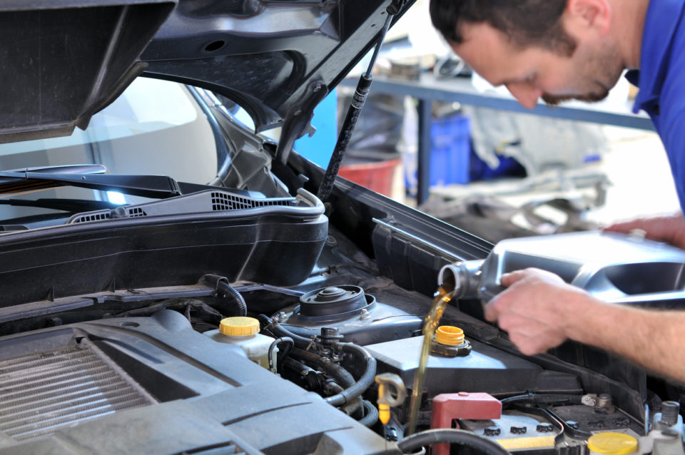 Mechanic performing an oil change