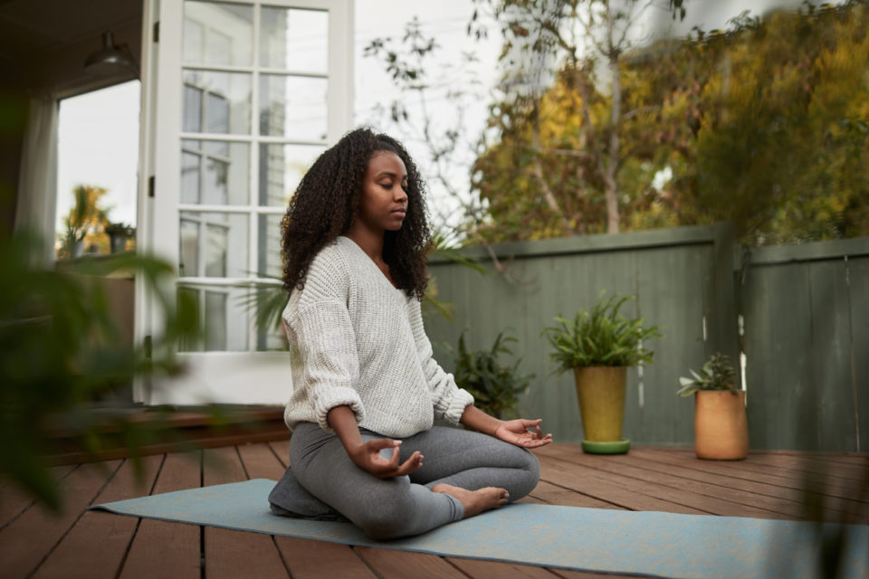 Woman in the lotus pose during a yoga session