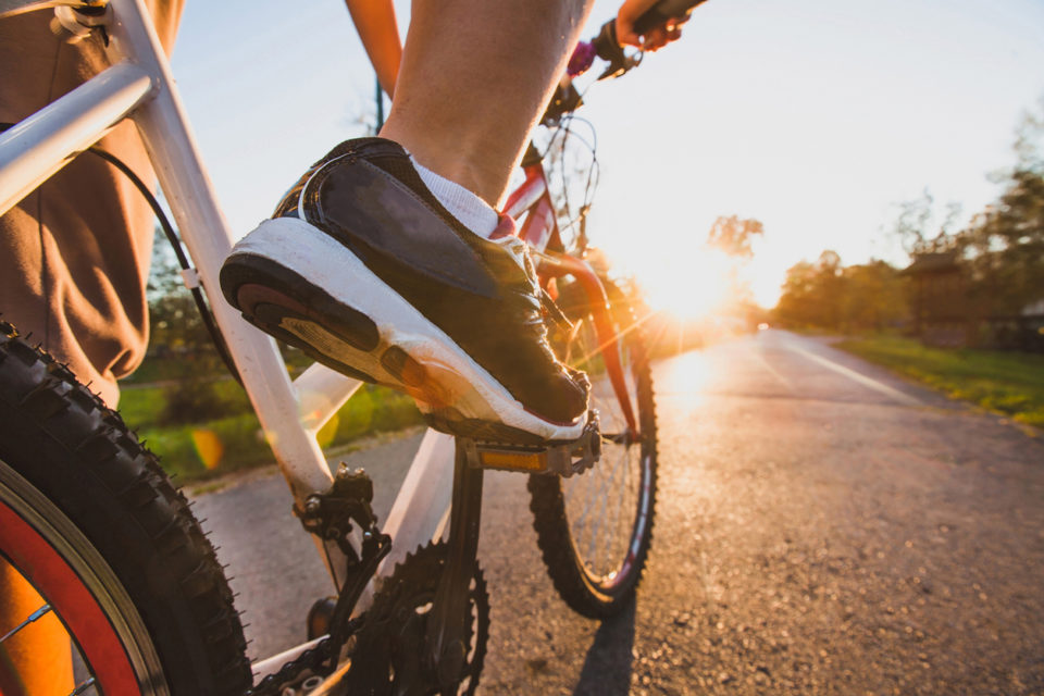 Cyclist biking on pavement