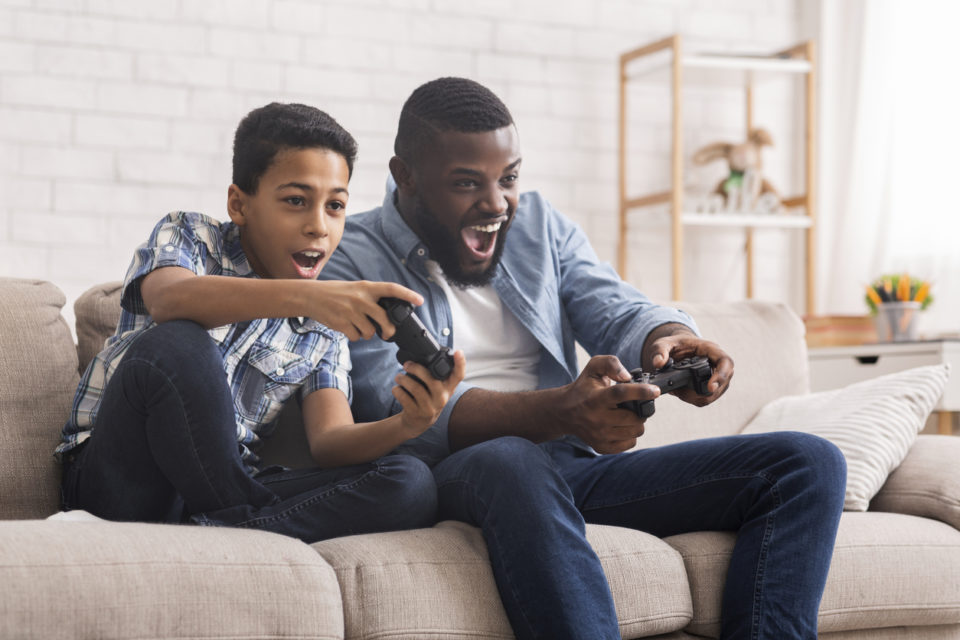 father and son playing video games