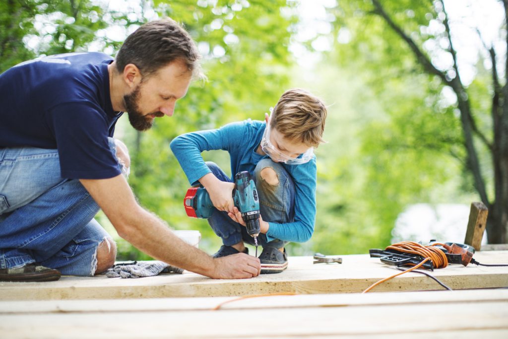 Father and son building a tree house