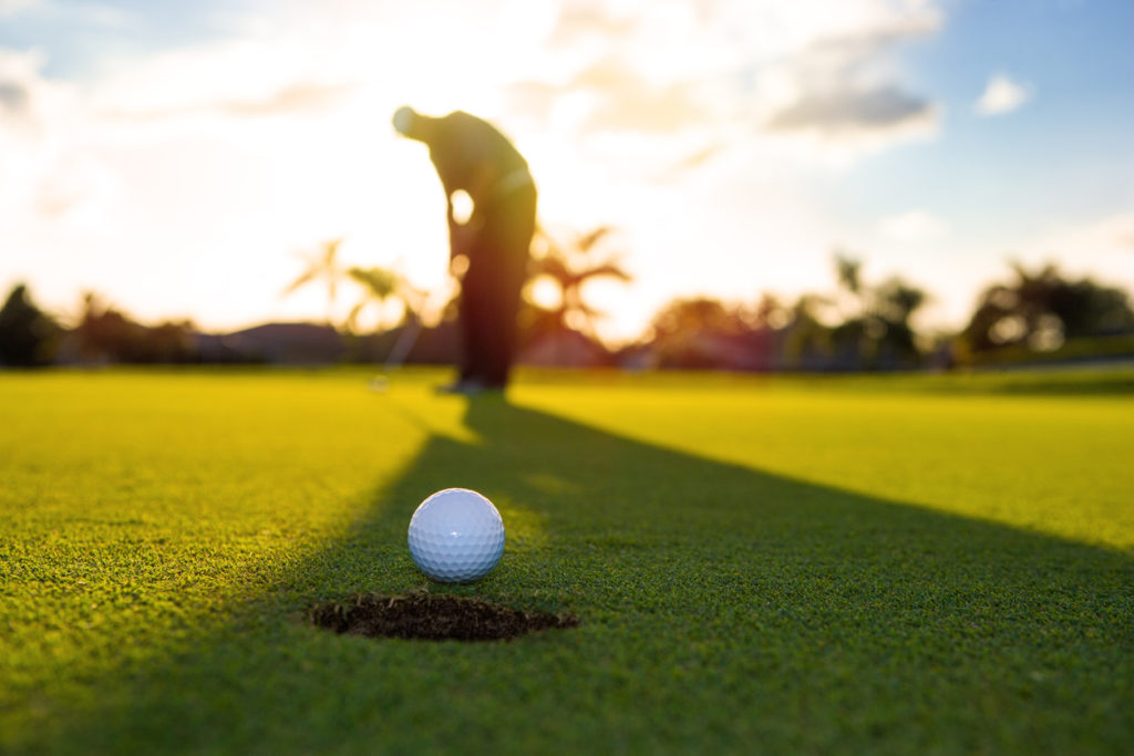 Early morning golf putting