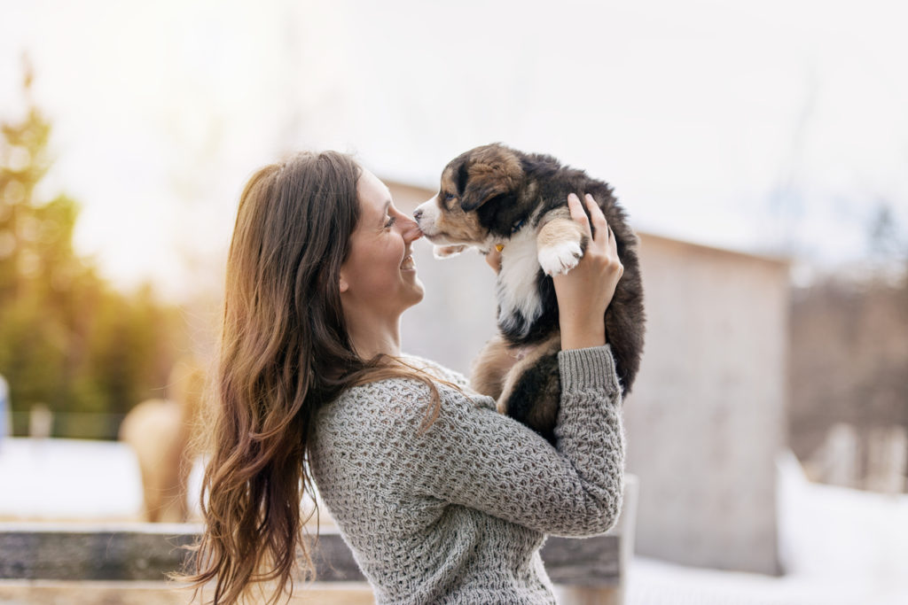 Woman holding puppy