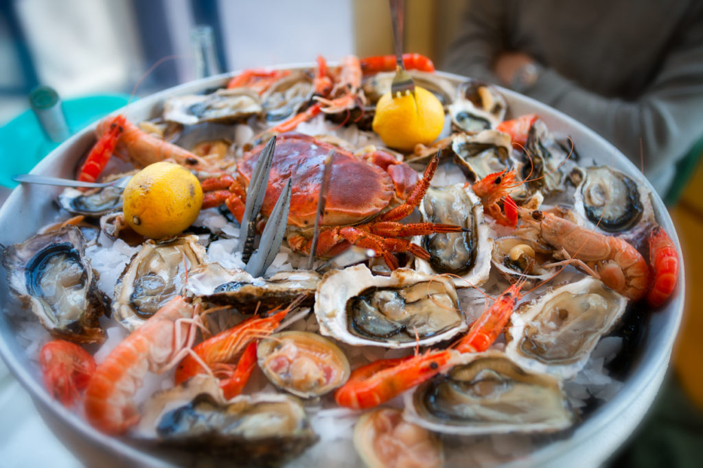 A selection of raw seafood dressed on chipped ice