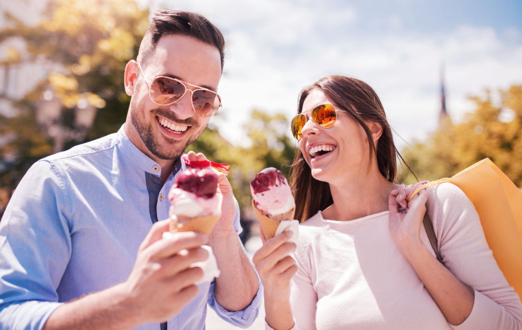 Beautiful young couple enjoying in shopping, having fun together