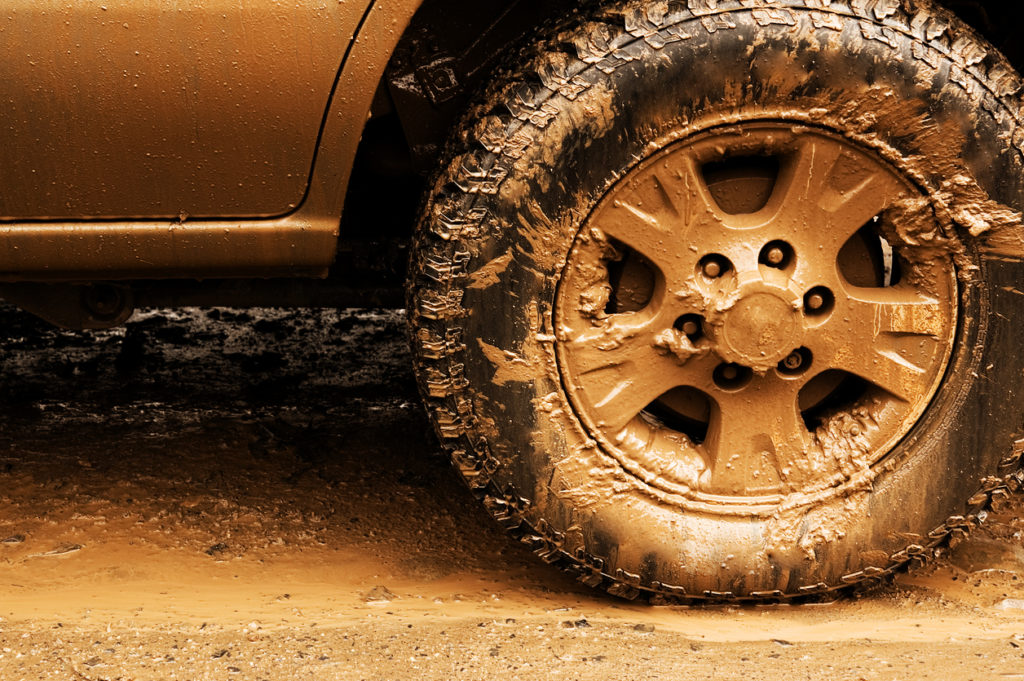 picture of muddy tire going offroading